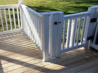 <b>Wood deck with white vinyl railing with black aluminum balusters1</b>